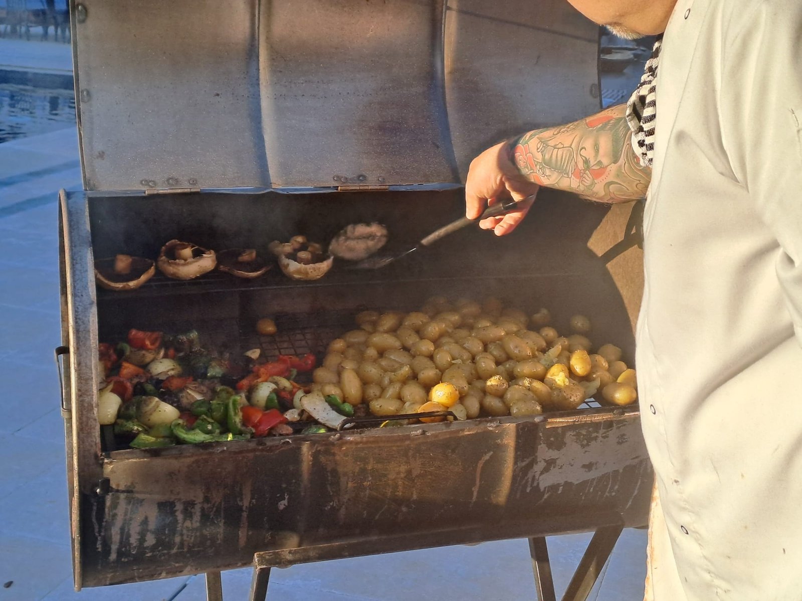 A Grill Seekers chef cooking vegetables on the smoker